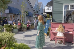 Soprano Eva Kavanagh performing at Kildare Village with Conor Prendeville and Ella Nagy, to mark the presentation of the inaugural Bríd Phelan Emerging Talent Award. The event celebrates one month to go until Blackwater Valley Opera Festival (27 May - 2 June 2025 www.blackwatervalleyopera.ie). Photo credit:Mark Reddy