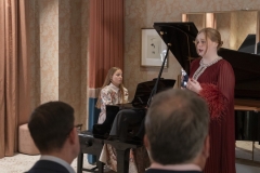 Soprano Eva Kavanagh performing at Kildare Village with Conor Prendeville and Ella Nagy, to mark the presentation of the inaugural Bríd Phelan Emerging Talent Award. The event celebrates one month to go until Blackwater Valley Opera Festival (27 May - 2 June 2025 www.blackwatervalleyopera.ie). Photo credit:Mark Reddy