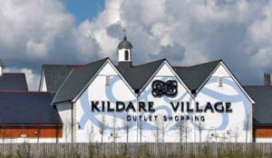 Kildare Shopping Village Main Building on a cloudy day